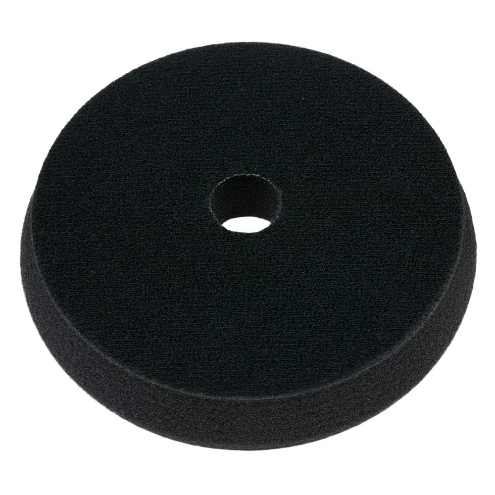 Black foam cutting pad with center hole, 5 inches in diameter, shown from above.