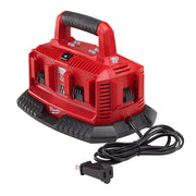 Red M18 six-pack sequential charger with black rubber handle and power cord, featuring multiple charging slots.