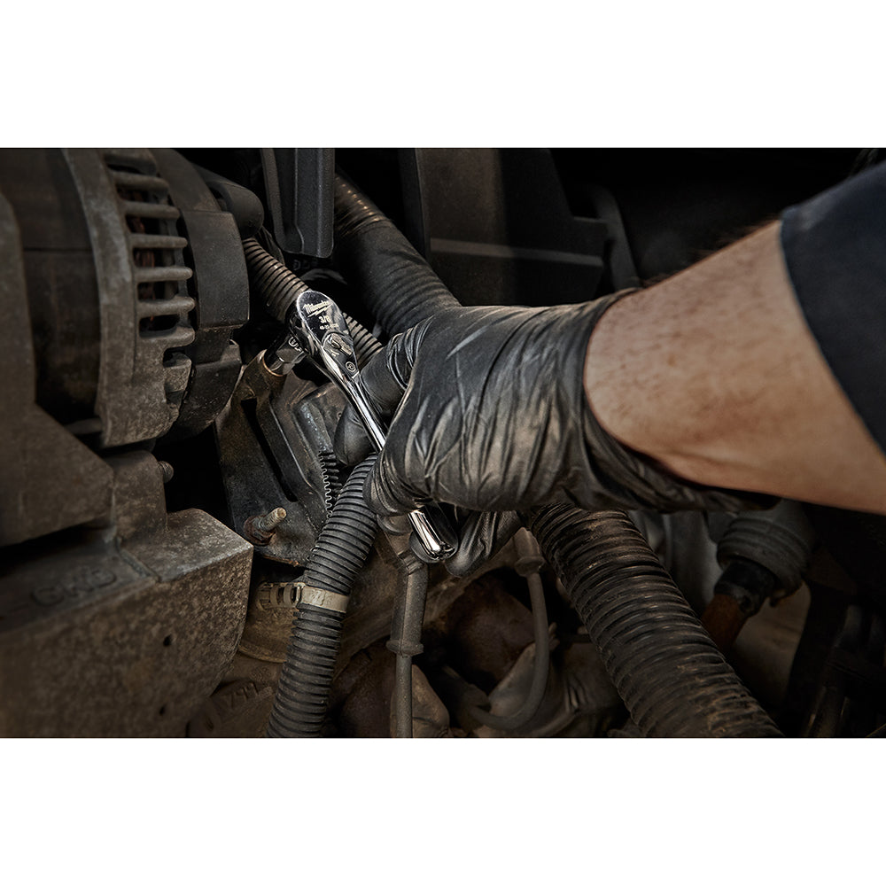 Milwaukee 3/8" drive ratchet with chrome finish being used on vehicle brake assembly.