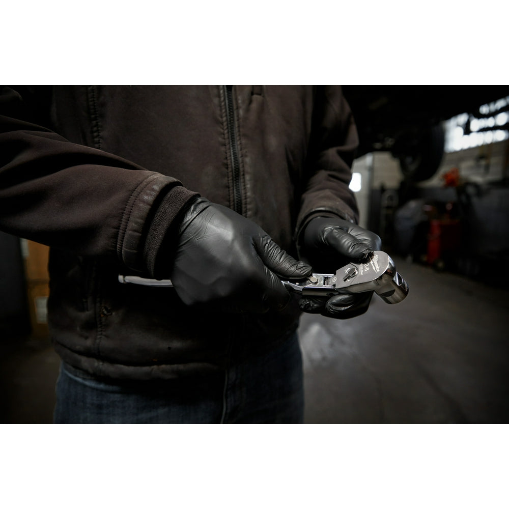 Person in black jacket and gloves holding a metal flex head ratchet with 3/8" drive.
