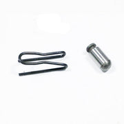 Black metal detent spring and silver cylindrical detent pin hardware components.