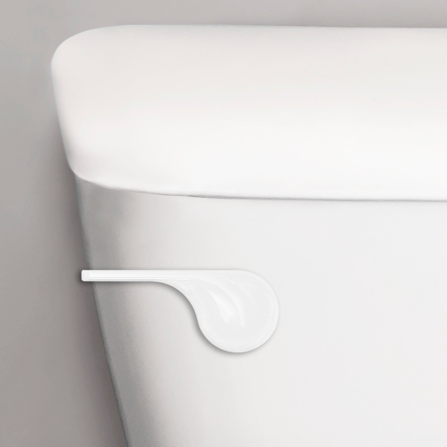 White wave-style toilet handle lever mounted on white porcelain toilet tank.