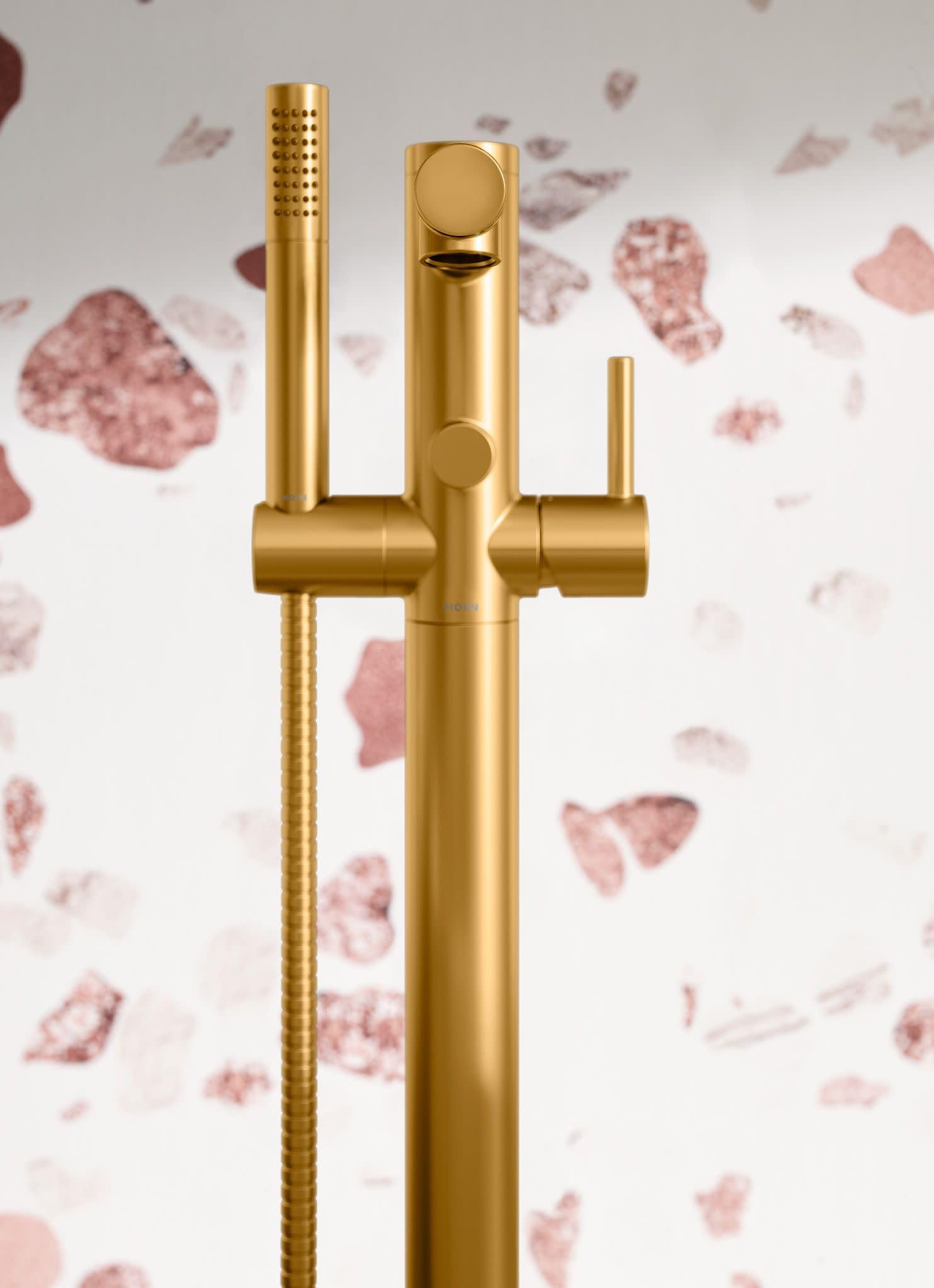 Brushed gold freestanding tub faucet with single handle, spout, and handheld showerhead with hose.
