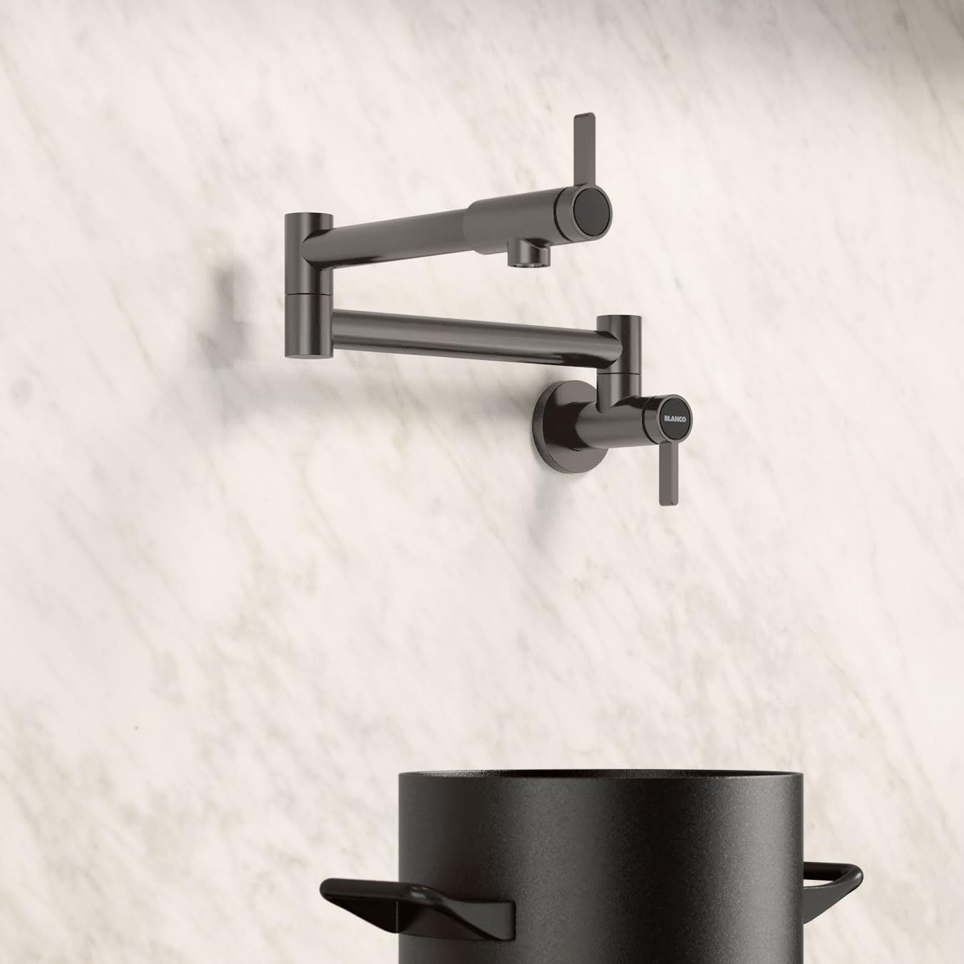 Satin dark steel wall-mounted potfiller faucet with articulating arm and lever handle above a black pot.