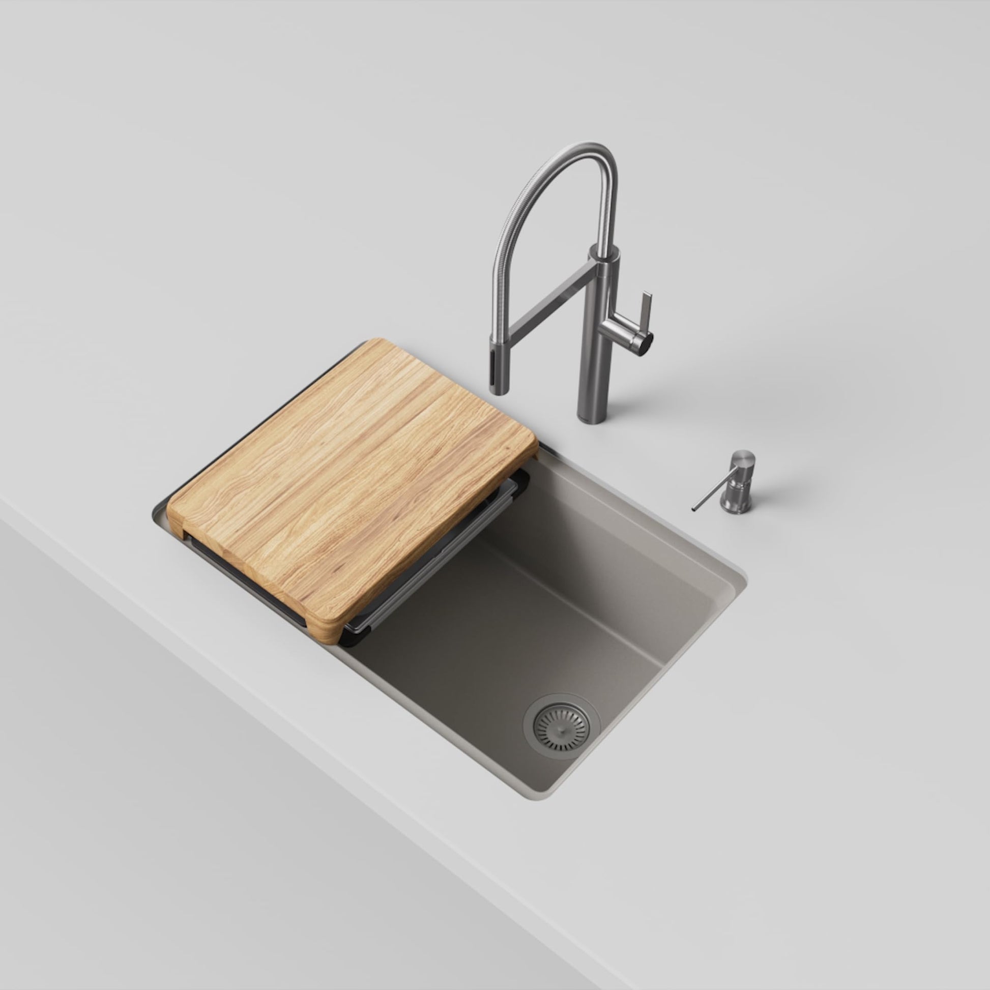 Truffle-colored kitchen sink with wooden cutting board, pull-down faucet, and soap dispenser in stainless steel finish.
