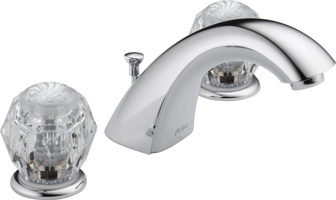 Chrome widespread bathroom faucet with two clear crystal knob handles and curved spout with pop-up drain.