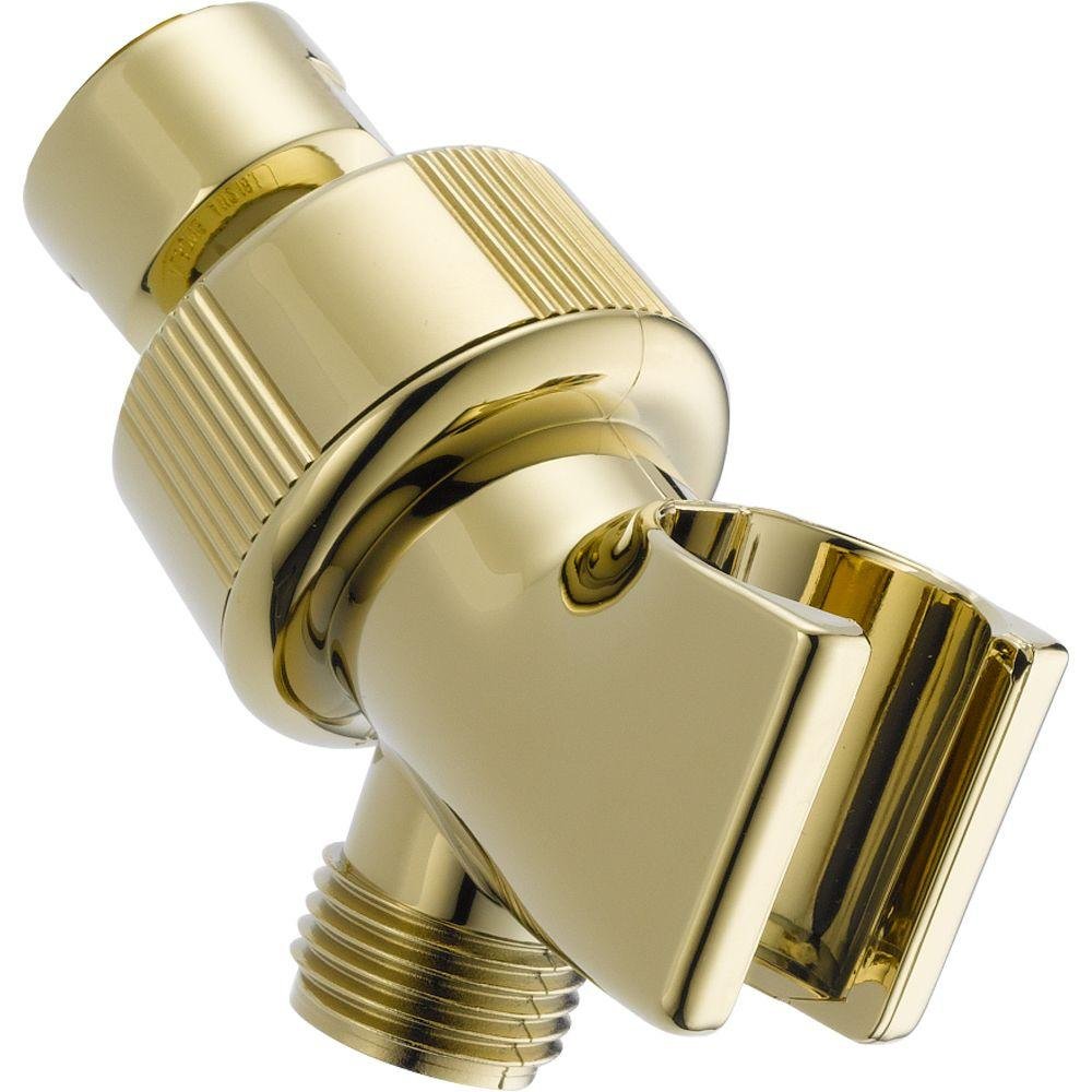 Polished brass shower arm mount with adjustable ball joint and hand shower holder bracket.