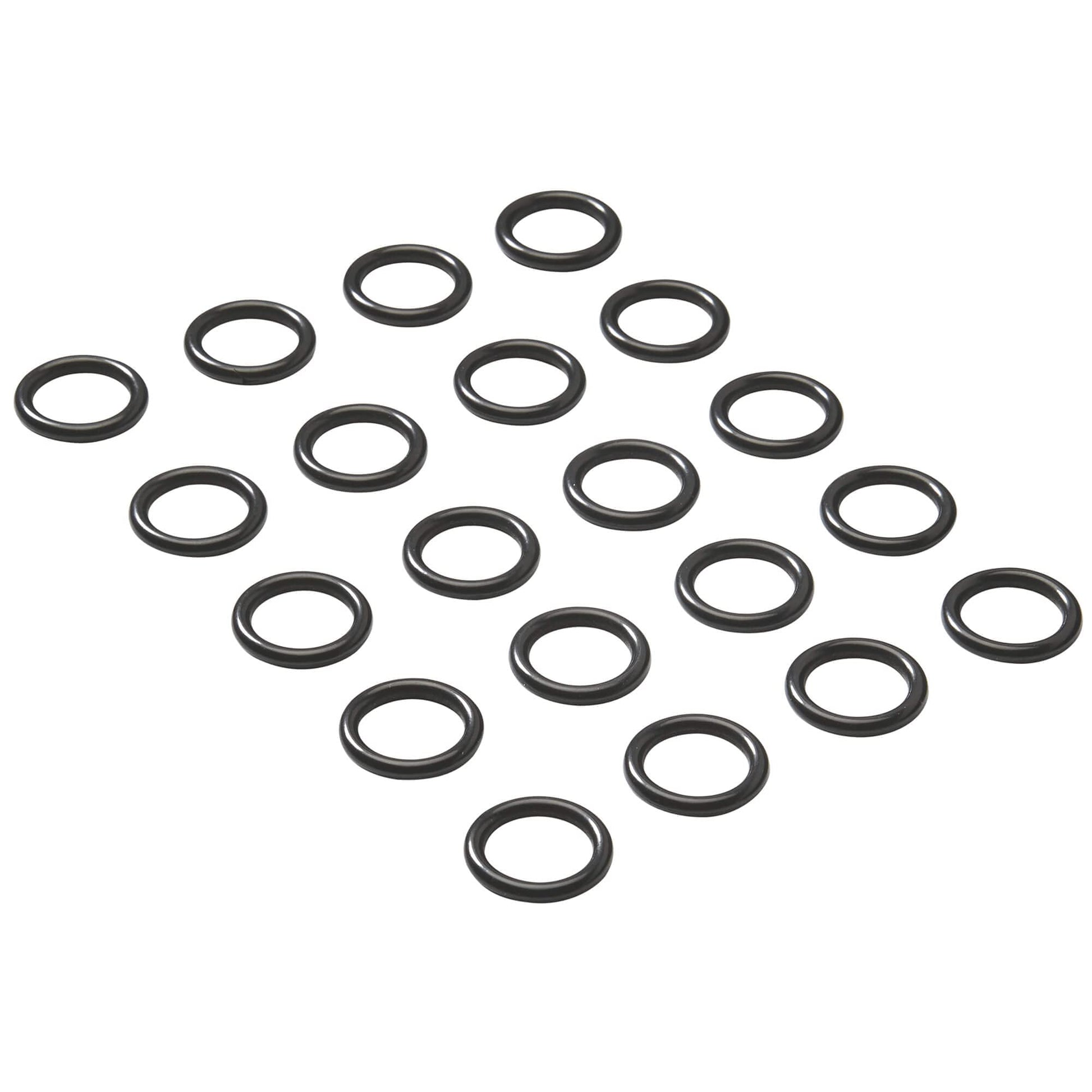 Multiple black rubber o-rings arranged in rows on white background.