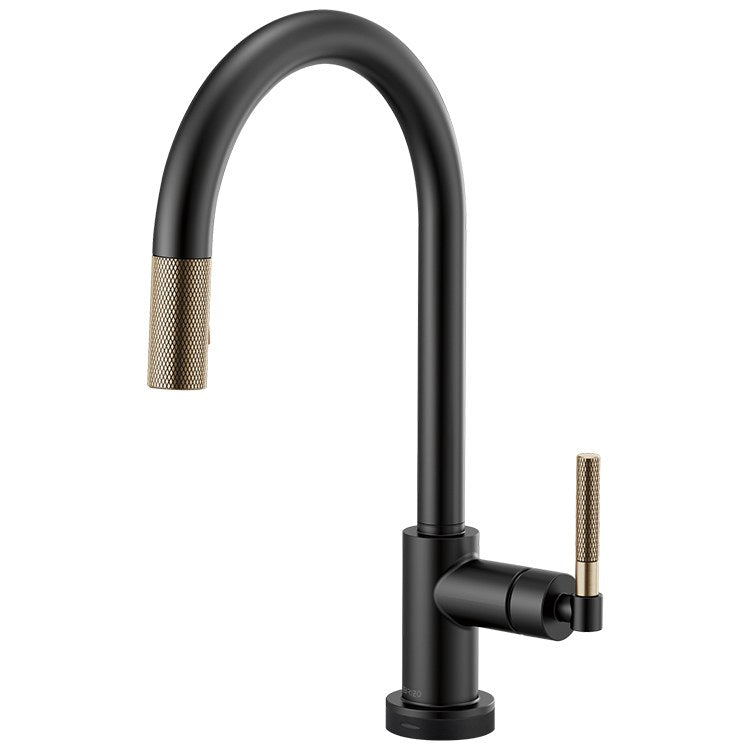 Black pull-down kitchen faucet with curved arc spout and knurled gold handles on matte black finish.