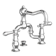 Bridge lavatory faucet with curved spout, two lever handles, and polished chrome finish.