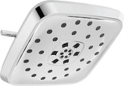 Square white shower head with multiple spray jets and central control dial, chrome arm attachment visible.