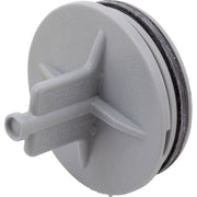 White plastic Delta pressure test cap with black rubber seal and protruding test valve.
