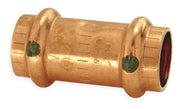 Copper press coupling with two green indicator dots and threaded ends on white background.
