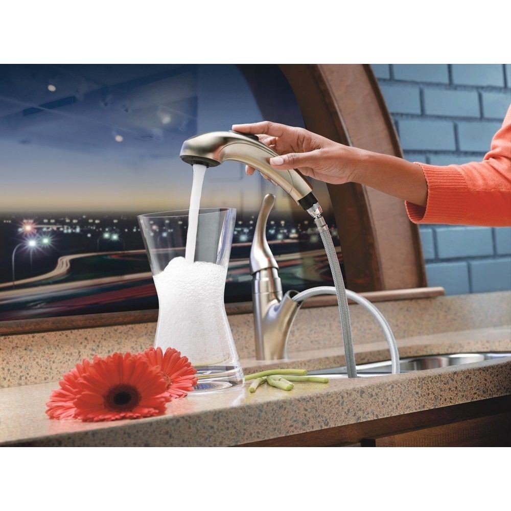 Stainless steel single handle kitchen faucet with curved spout and pull-down hose attachment on countertop.