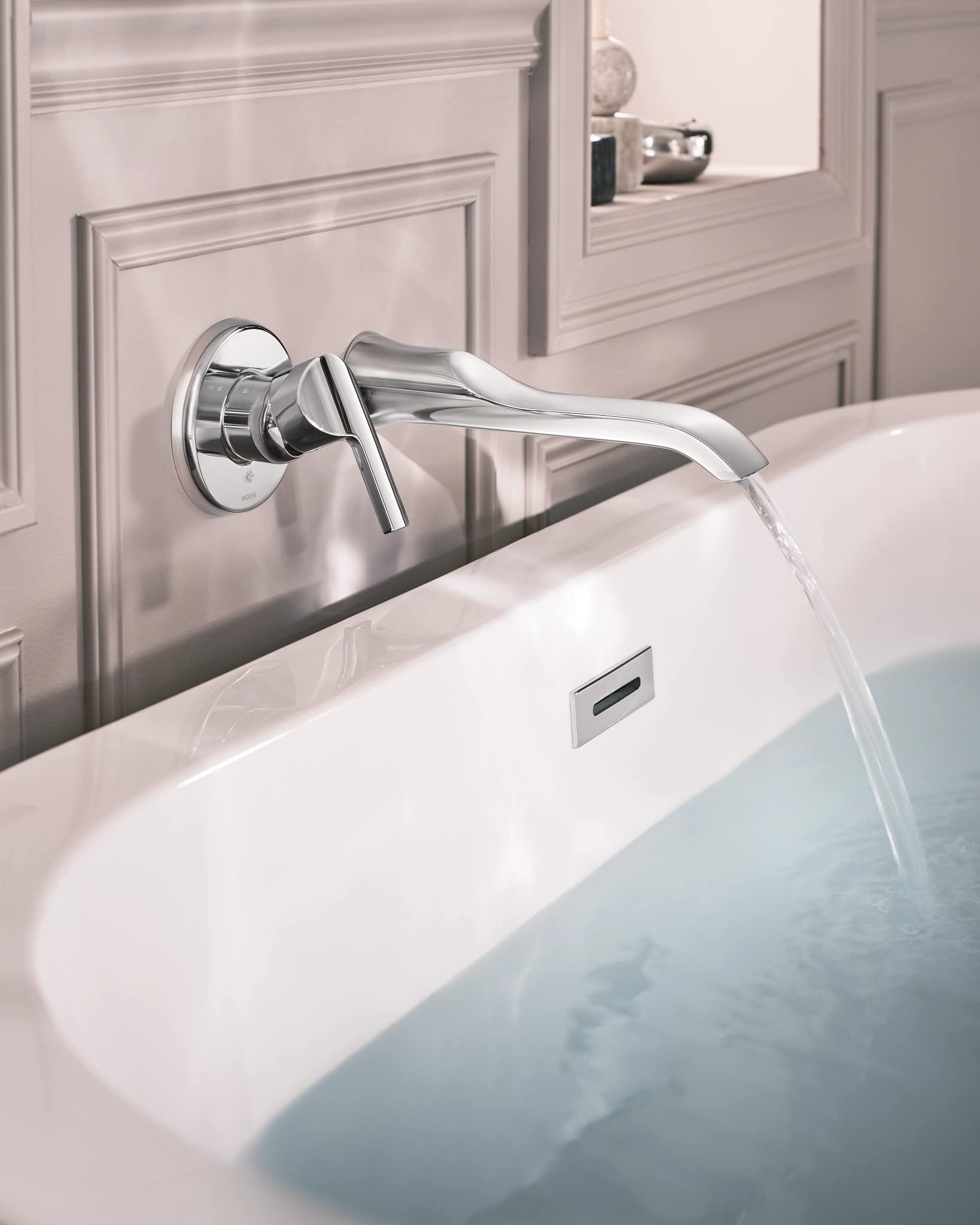 Chrome wall-mounted tub faucet with single handle lever and curved spout dispensing water into bathtub.