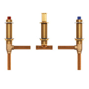 Brass and copper rough-in valve assembly with three outlets, red and blue control stems, and copper supply lines.