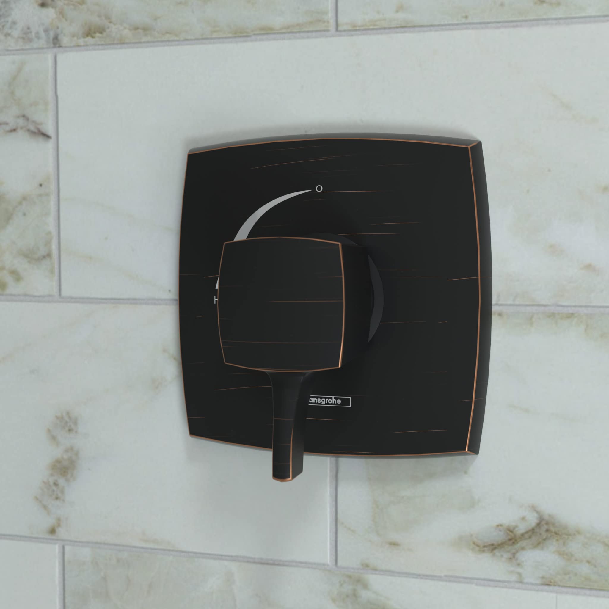 Square rubbed bronze pressure balance valve trim with single lever handle mounted on marble subway tile wall.