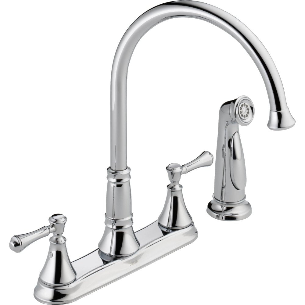 Chrome two-handle kitchen faucet with high arc spout, detachable spray head, and lever handles on deck plate base.