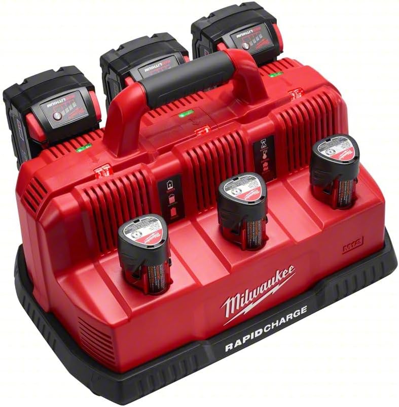 Red Milwaukee rapid charge station with three battery slots holding black and red batteries and four smaller battery chargers