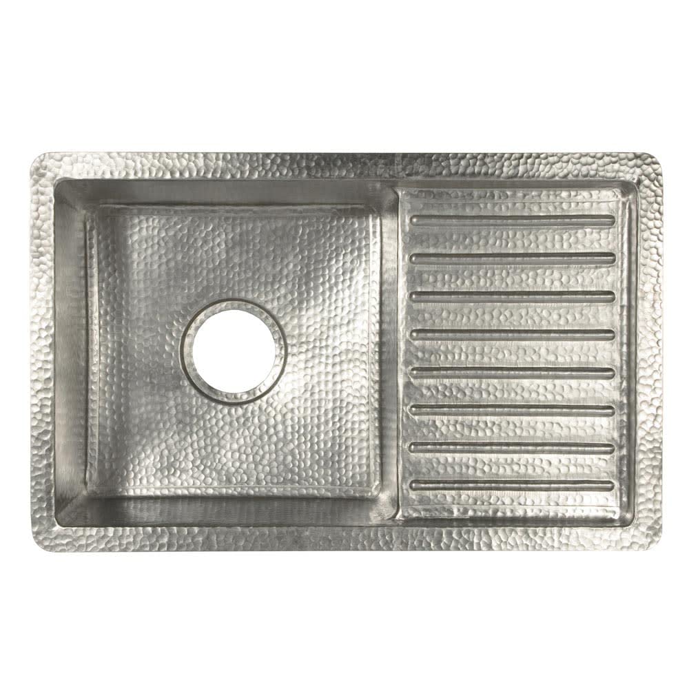 Hammered copper undermount sink with two compartments: larger basin on left and smaller drainboard on right with horizontal r