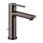 Single-handle bathroom faucet in hard graphite with cylindrical body and extended spout.