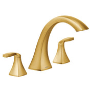 Gold deck mount Roman tub faucet with two handles and curved spout.