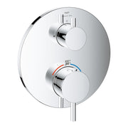 Chrome thermostatic valve trim with circular escutcheon plate, two round handles, and temperature gauge displaying Fahrenheit