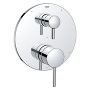 Chrome pressure balance valve trim with two round handles and diverter control on circular escutcheon plate.