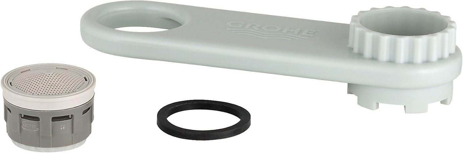 White plastic Grohe flow control repair kit with aerator, wrench tool, and black rubber seal ring.