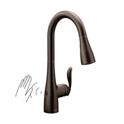 Oil rubbed bronze pulldown kitchen faucet with single handle and touchless motion sensor activation.