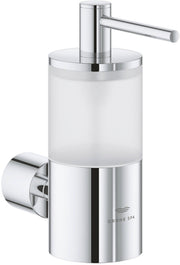 Chrome soap dispenser with cylindrical frosted glass reservoir and wall-mounted pump lever.