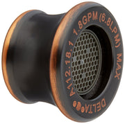 Oil rubbed bronze kitchen faucet aerator with honeycomb mesh screen and flow rate specifications visible on rim.