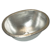 Oval copper bathroom sink with hammered texture finish and decorative rim, shown from above at an angle.