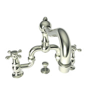 Polished nickel bridge faucet with curved spout, two cross handles, and dome cap, shown with separate drain plug.