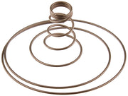 Bronze-colored metal spring coils arranged in concentric circular loops of decreasing size.