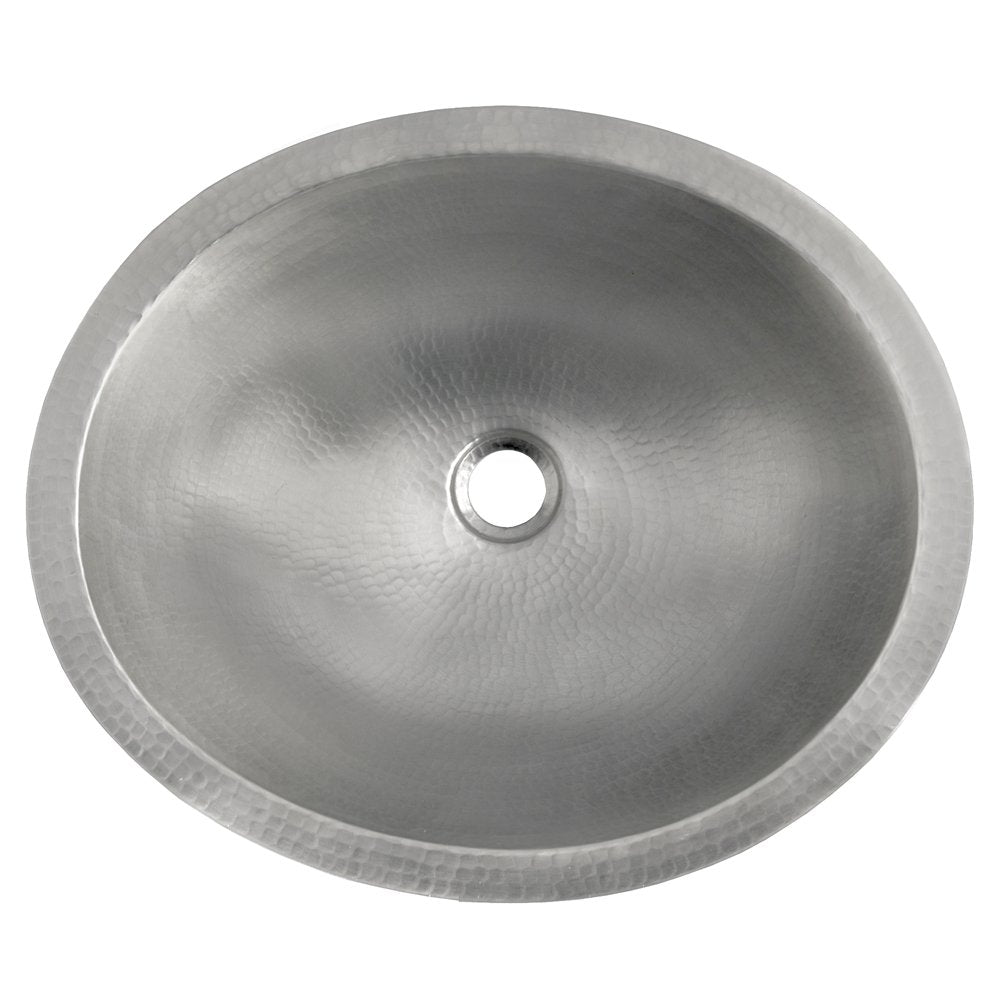 Round brushed nickel bathroom sink with hammered copper interior and single drain hole, overhead view.