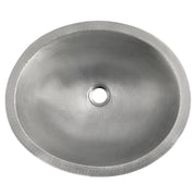 Round brushed nickel bathroom sink with hammered copper interior and single drain hole, overhead view.
