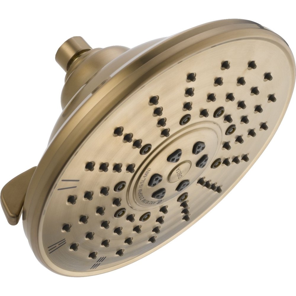 Champagne-bronze raincan shower head with multiple spray jets and control dial, viewed from front angle.