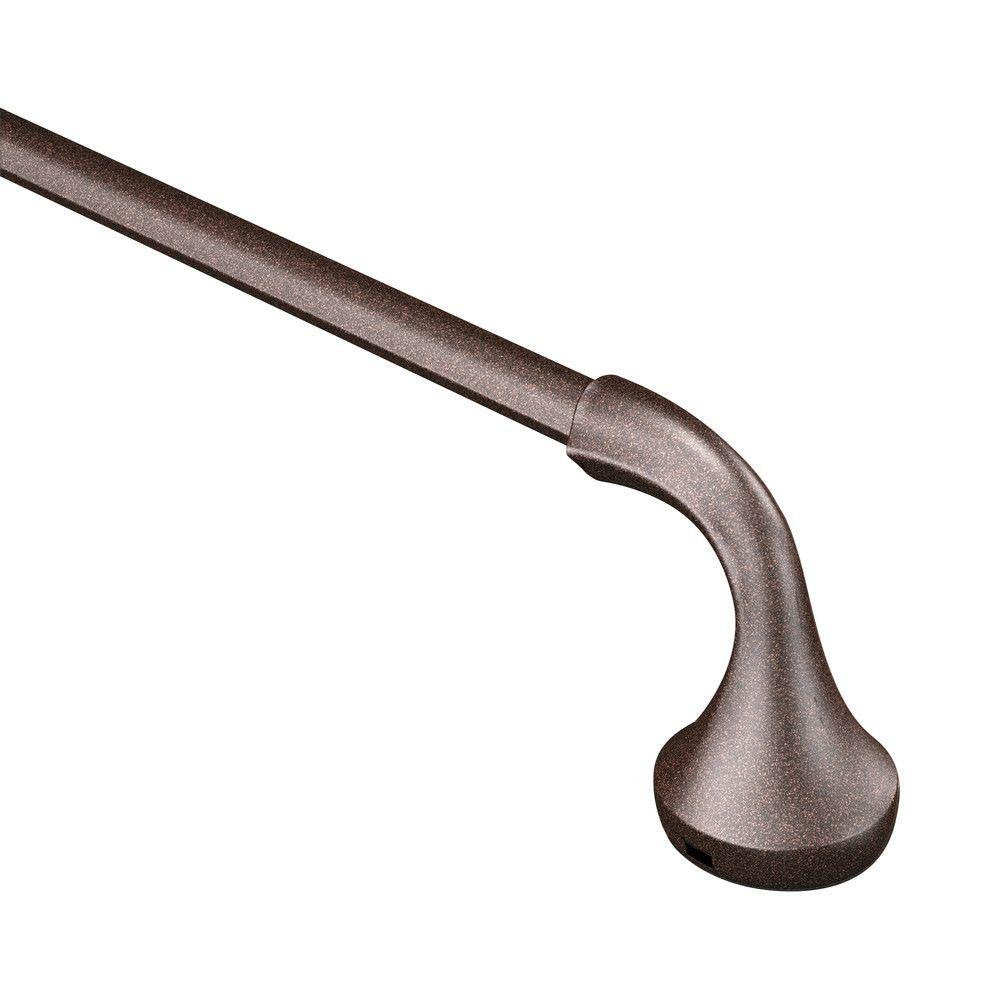 Oil rubbed bronze towel bar with curved cylindrical design and rounded end cap.