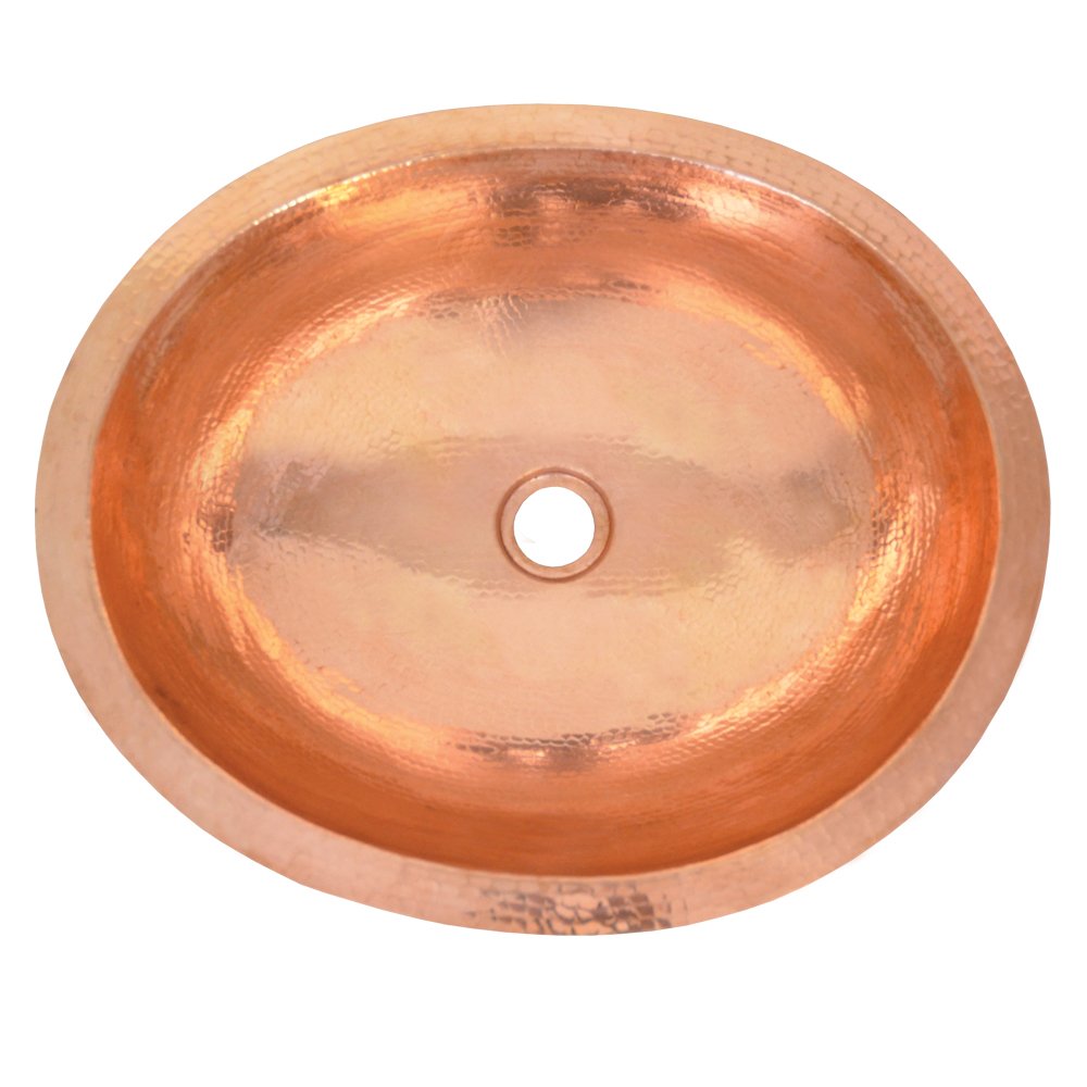 Polished copper oval sink with single center drain hole, viewed from above.