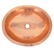 Polished copper oval sink with single center drain hole, viewed from above.