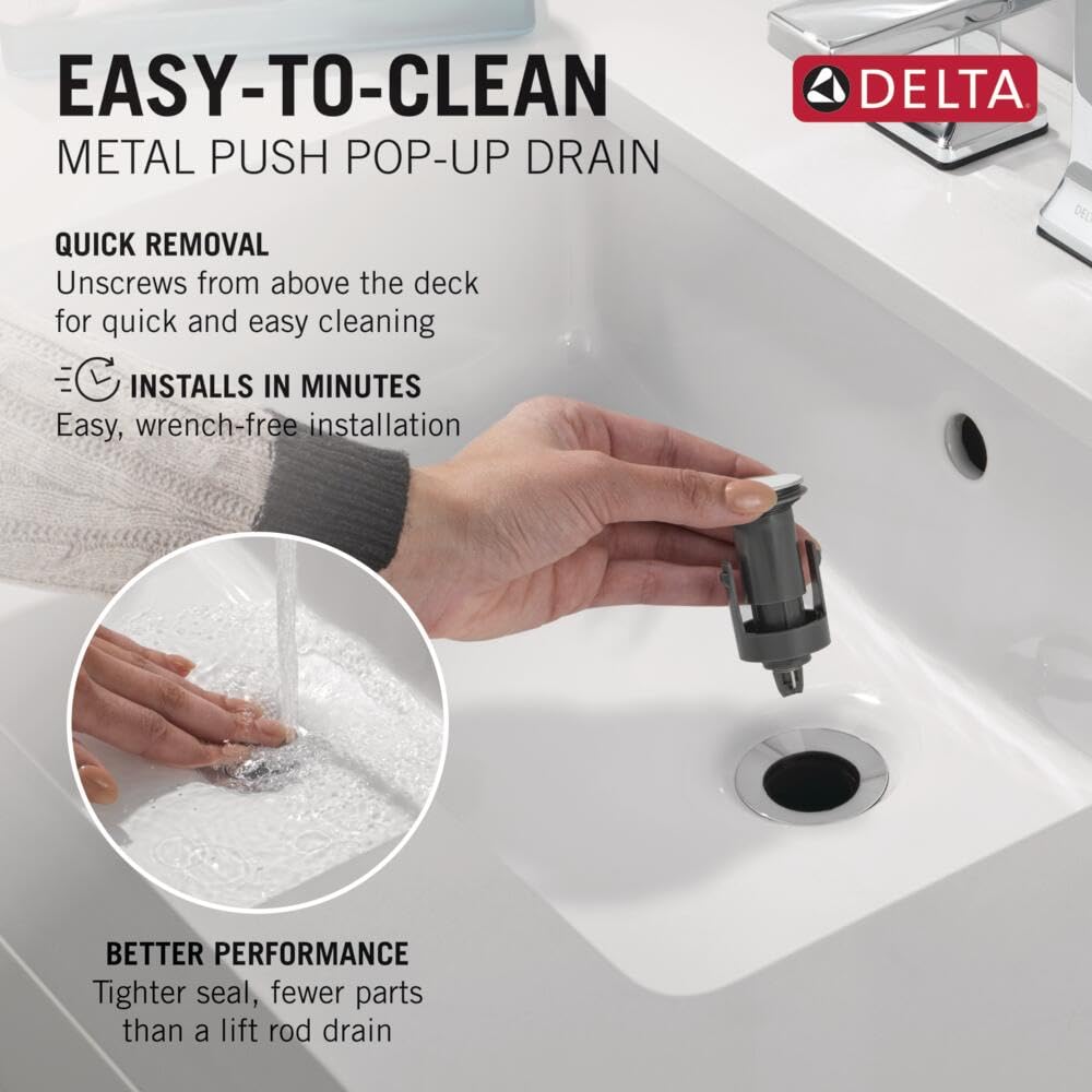 Chrome push pop-up drain with removable cartridge displayed above white sink basin.