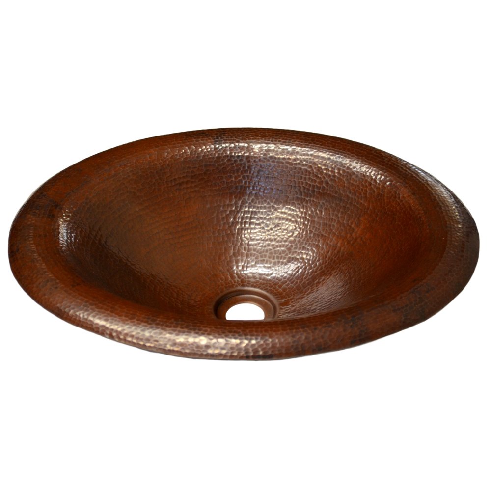Oval copper bathroom sink with hammered texture and antique brown finish, shown from above.
