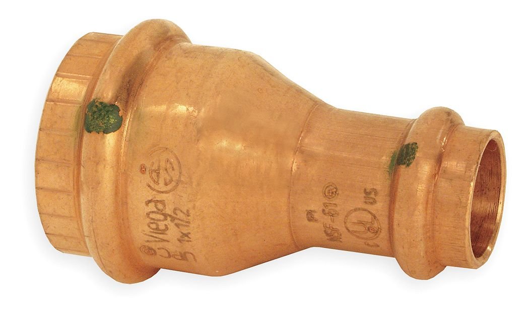 Copper press reducer fitting with larger diameter on left side and smaller diameter on right side, green indicators visible o