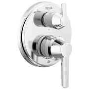 Chrome Delta shower trim with dual lever handles and integrated diverter valve mounted on circular trim plate.