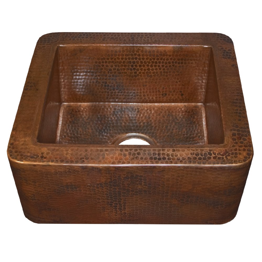 Hammered copper undermount bar sink with divided basin and rounded corners, shown from above.