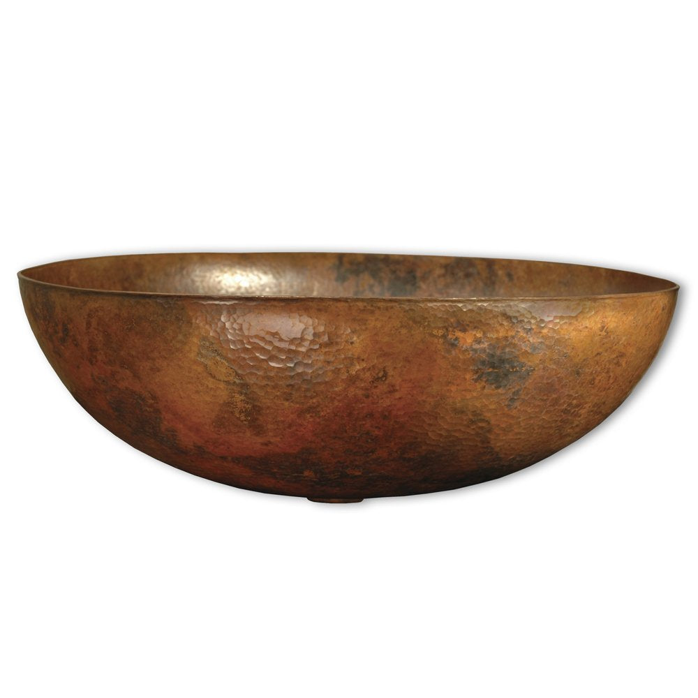Oval hammered copper vessel sink with brown patina finish and textured surface.