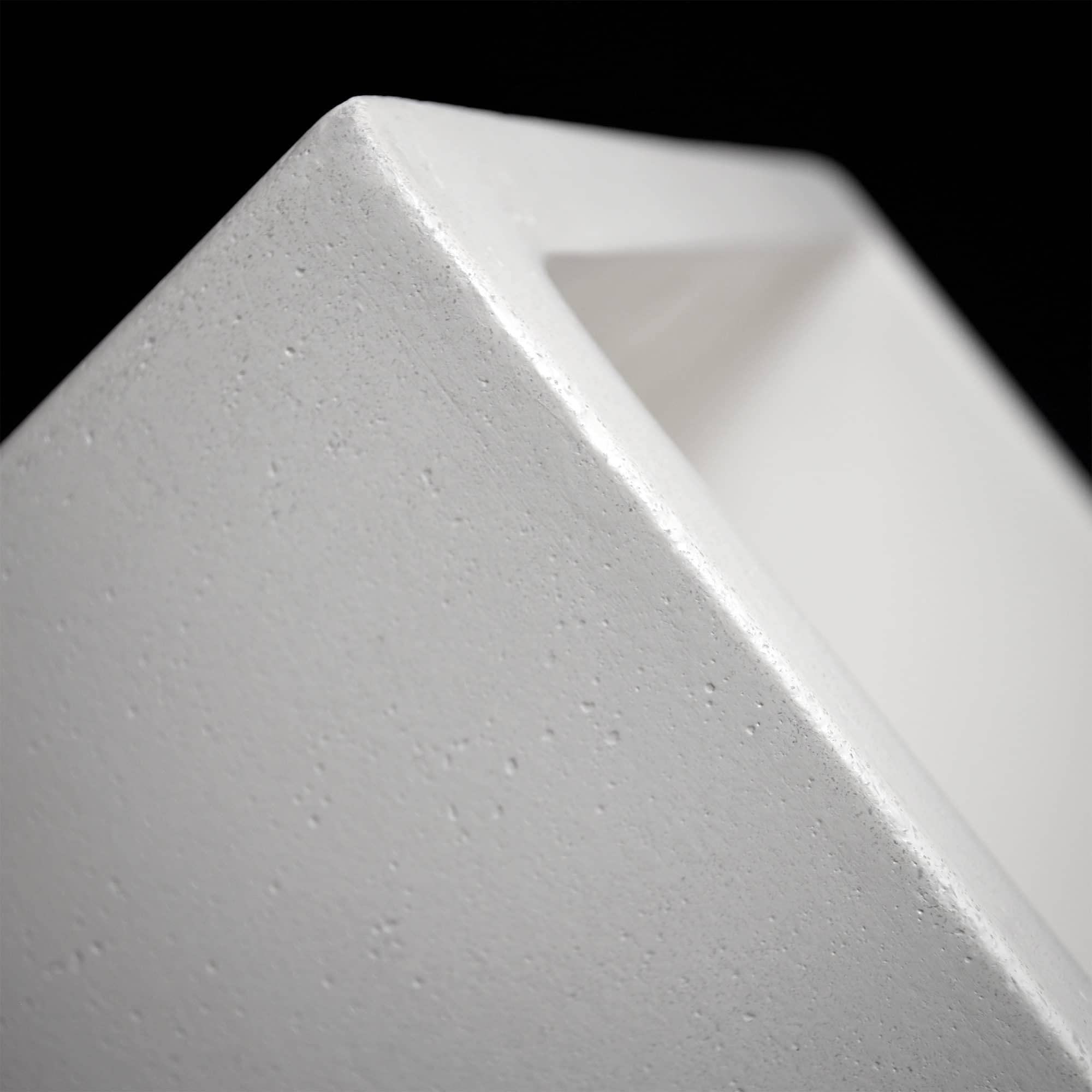 Rectangular concrete bar sink with sloped edges and integrated basin in light gray finish.