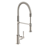 Polished nickel semi-pro kitchen faucet with coiled spray hose, single lever handle, and tall arched spout.