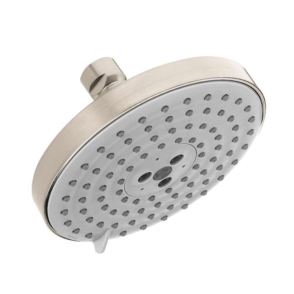 Brushed nickel shower head with white face plate and multiple spray jets positioned at an angle.
